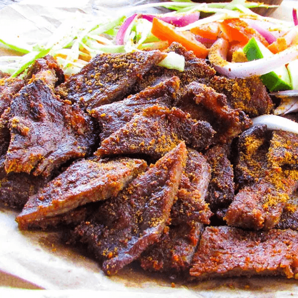 photo — chef grilling suya